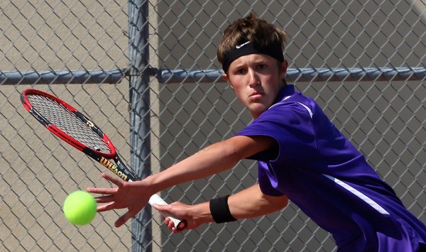 Spencer Denney has his eye on the ball in Wednesday's Division III tennis match final.